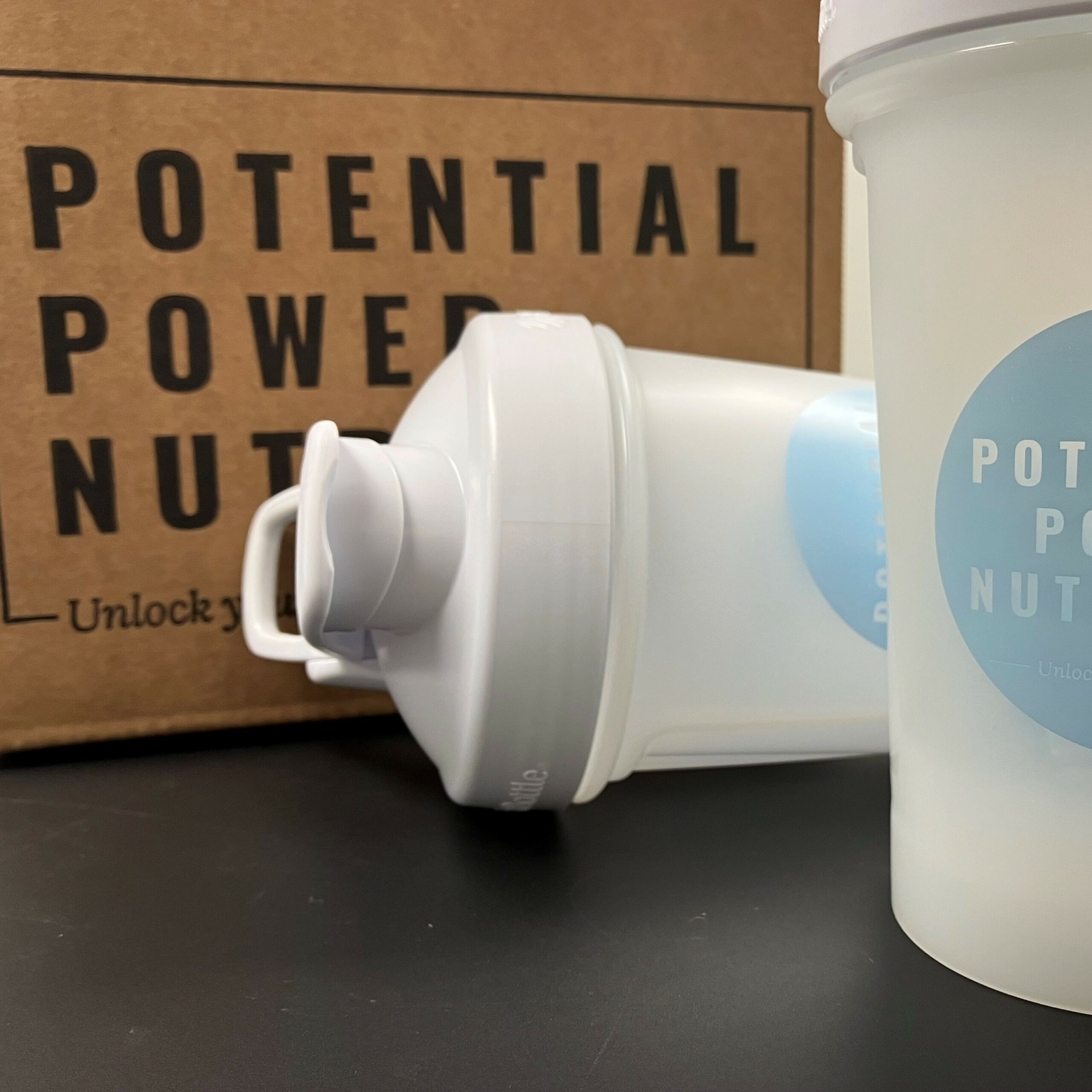 https://www.potentialpowernutrition.com/wp-content/uploads/2022/02/2-Cnt-with-2-shakers-up-front-scaled.jpg